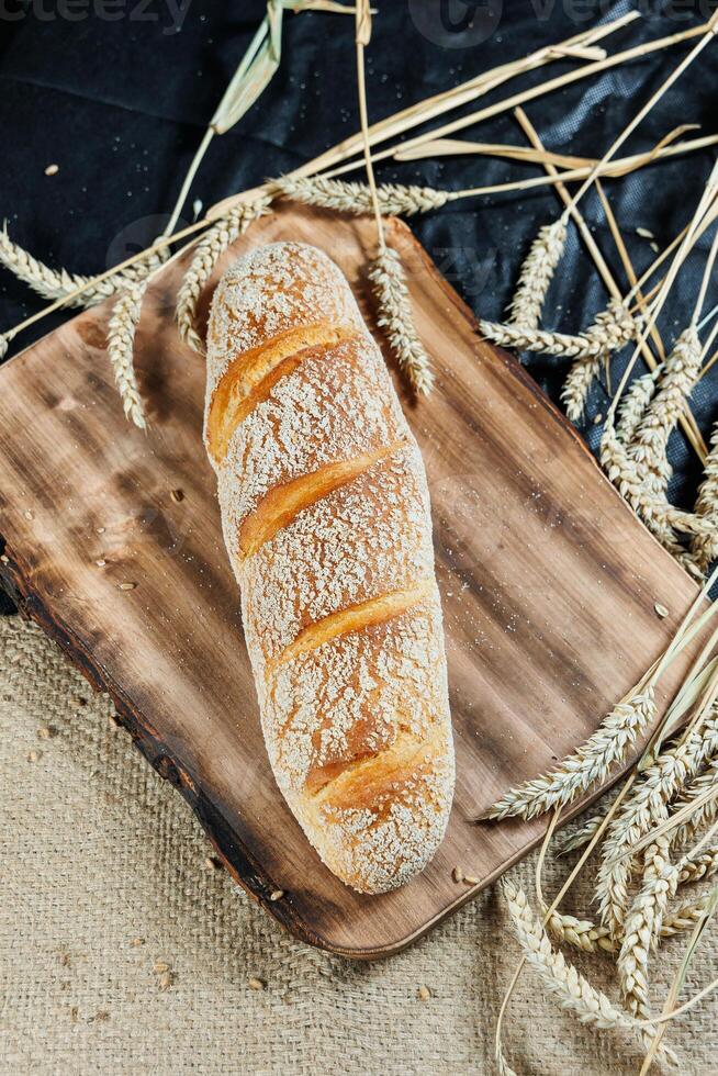 Freshly baked rye bread on a mixture of whole grain, rye and wheat flour. Fresh homemade bread. Craft pastries photo