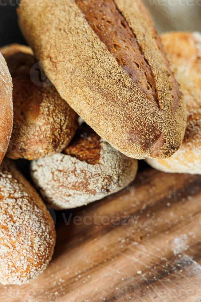 Freshly baked rye bread on a mixture of whole grain, rye and wheat flour. Fresh homemade bread. Craft pastries photo