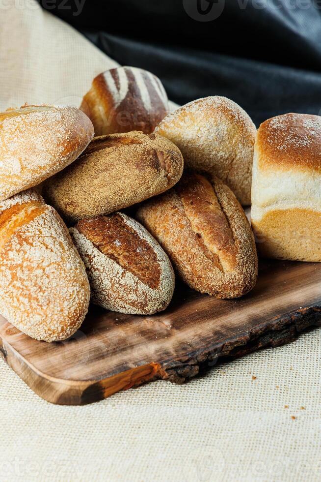 Freshly baked rye bread on a mixture of whole grain, rye and wheat flour. Fresh homemade bread. Craft pastries photo