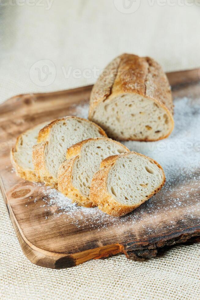 Freshly baked rye bread on a mixture of whole grain, rye and wheat flour. Fresh homemade bread. Craft pastries photo