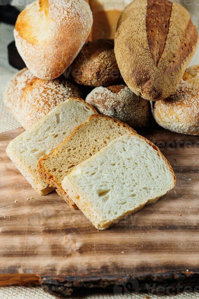 Freshly baked rye bread on a mixture of whole grain, rye and wheat flour. Fresh homemade bread. Craft pastries photo