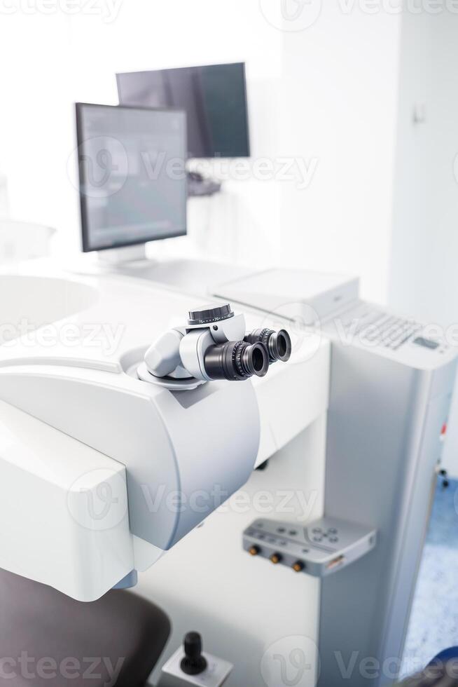 Microscopic apparatus for testing eyesight. Ophthalmology and treatment of eye diseases. Eye clinic, optometrist concept photo