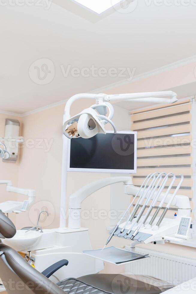 Modern stylish bright dental office with a new chair for receiving patients. selective focus photo