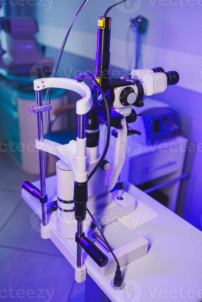 A modern microscope for vision testing in a light room. Microscope for vision correction. photo