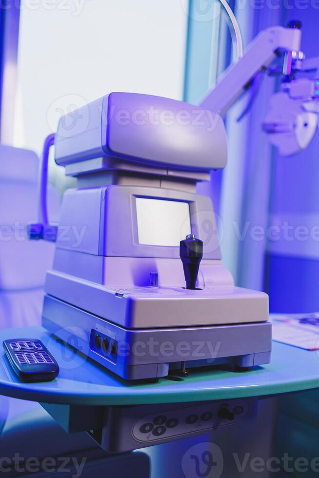 A modern microscope for vision testing in a light room. Microscope for vision correction. photo