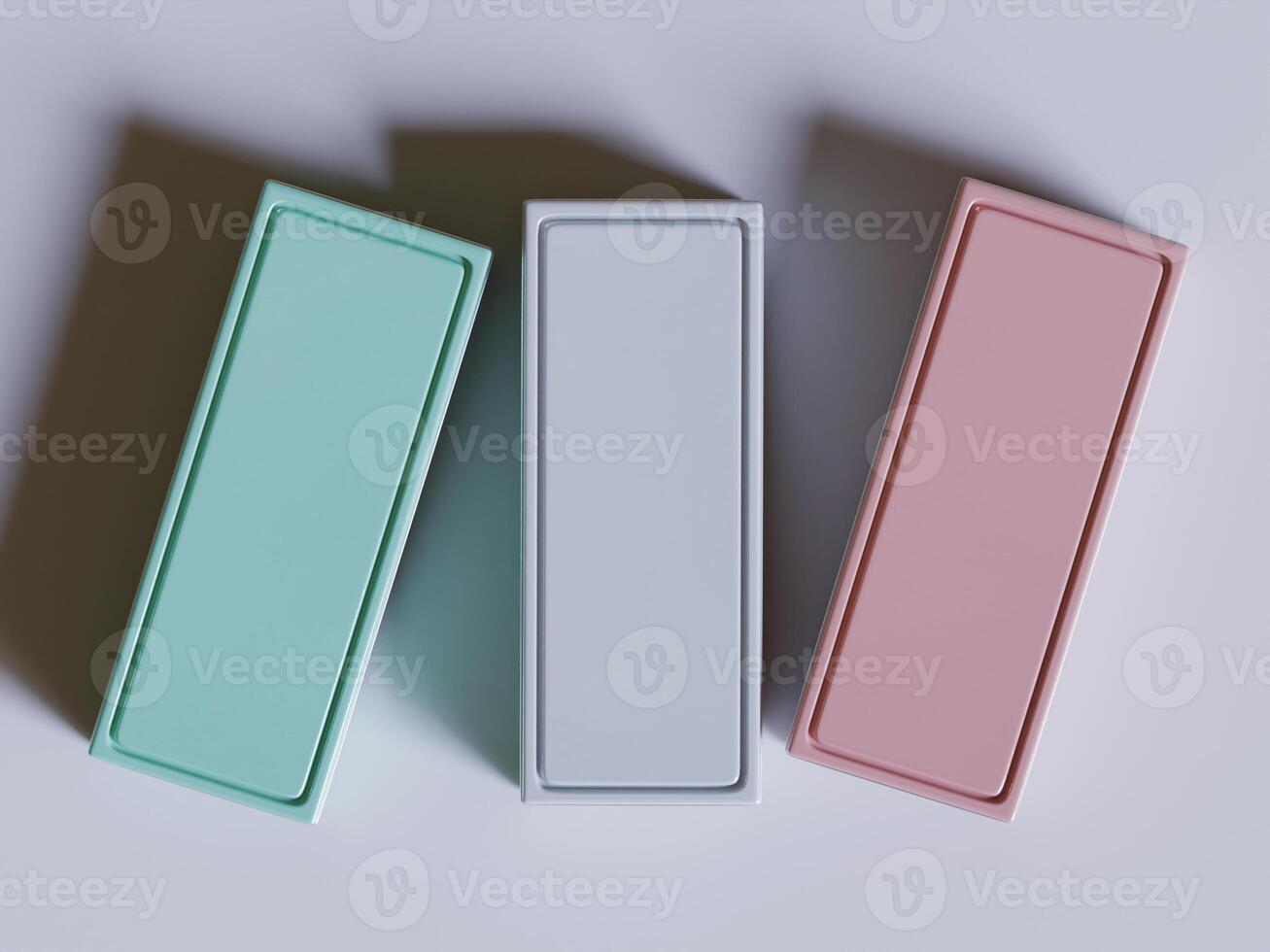 Three different colored boxes with white and pink on them photo