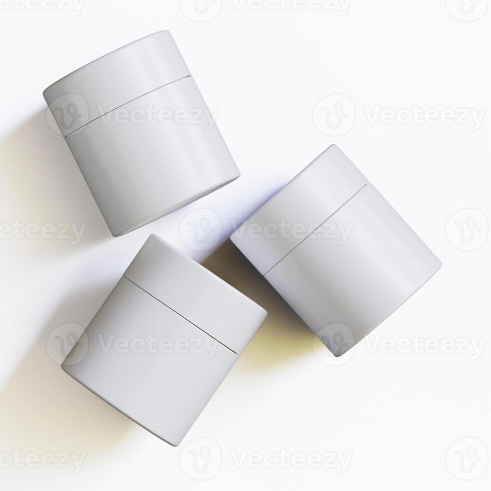 Three white containers with lids on a white surface photo