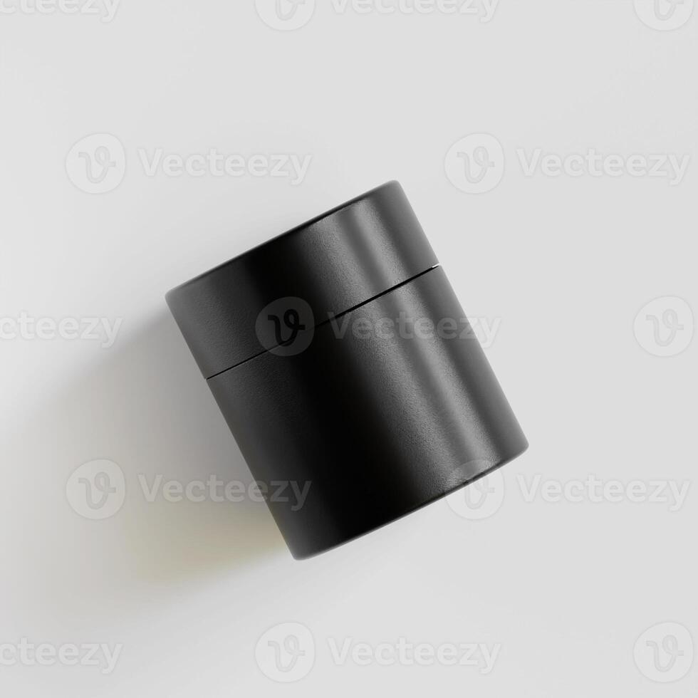 A black container sitting on a white surface photo