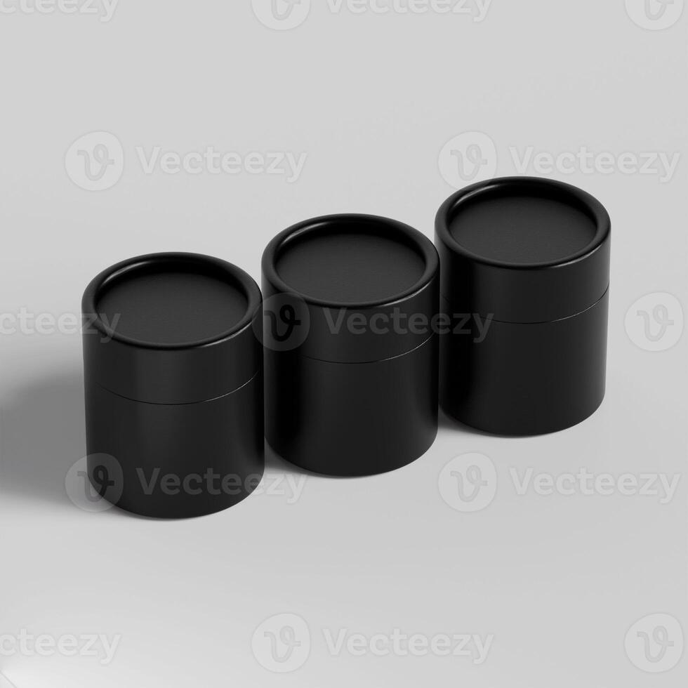 Three black containers with lids on a white surface photo