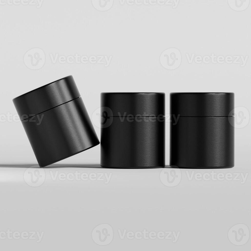 Three black containers with lids on a white surface photo