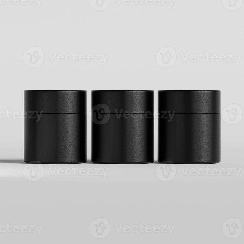 Three black containers with lids on a white surface photo