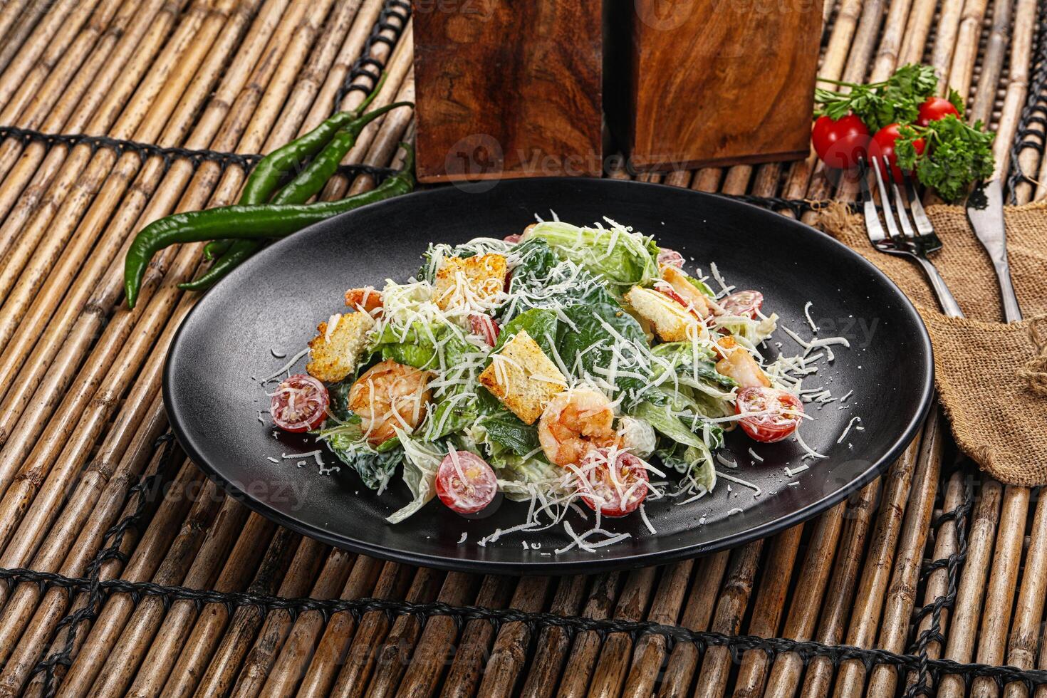 Tasty Caesar salad with prawn photo