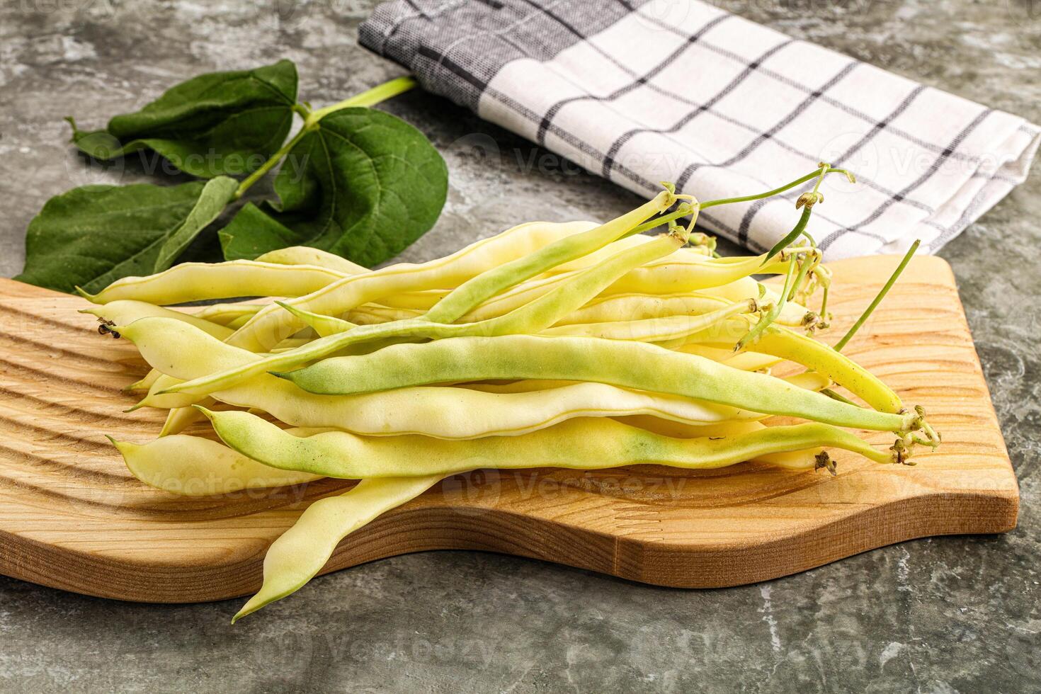 Raw green bean strings heap photo