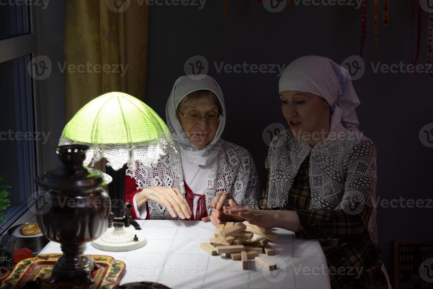 Two women sitting at a table photo