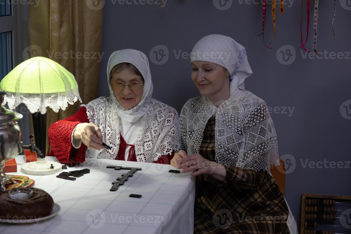 Two women sitting at a table photo