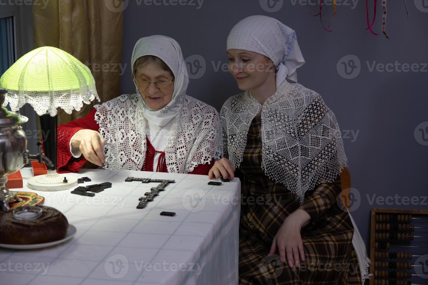 Two women sitting at a table photo