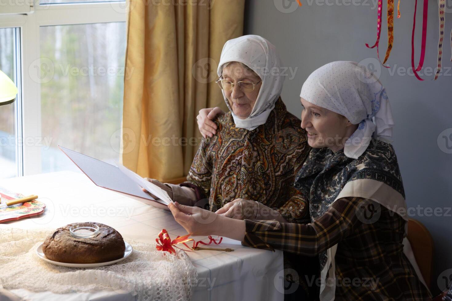 Two women sitting at a table photo