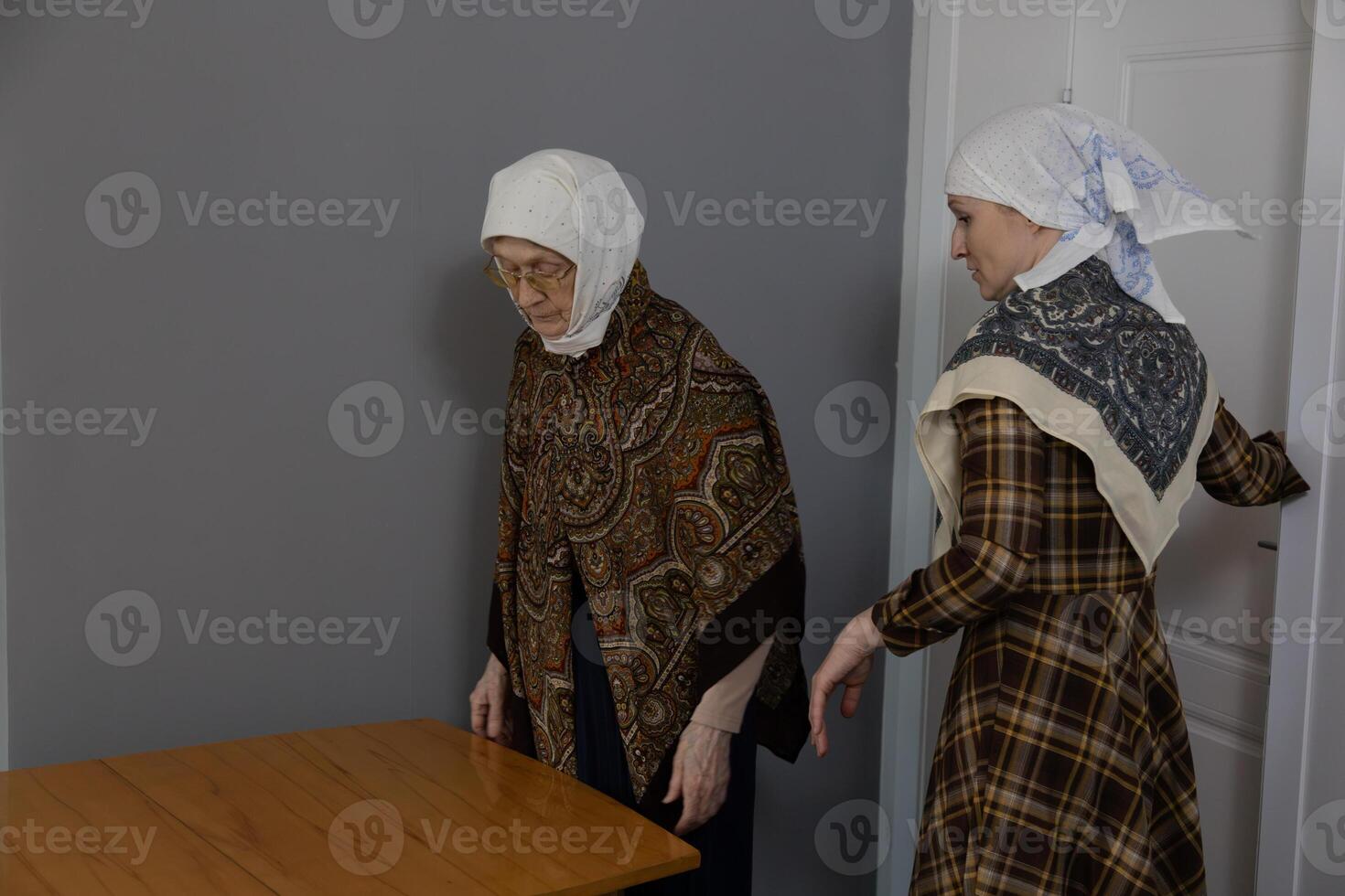 Two women standing next to each other photo