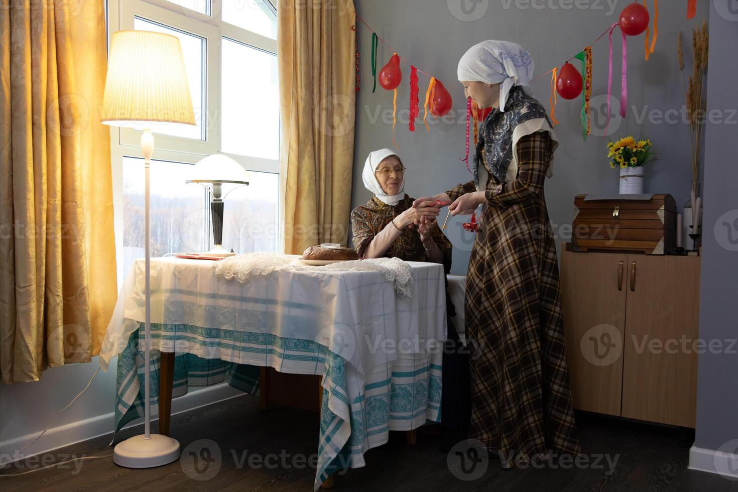 Two women in a room photo