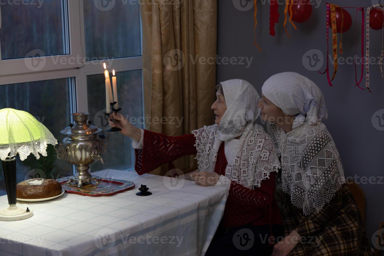 Two women sitting at a table photo
