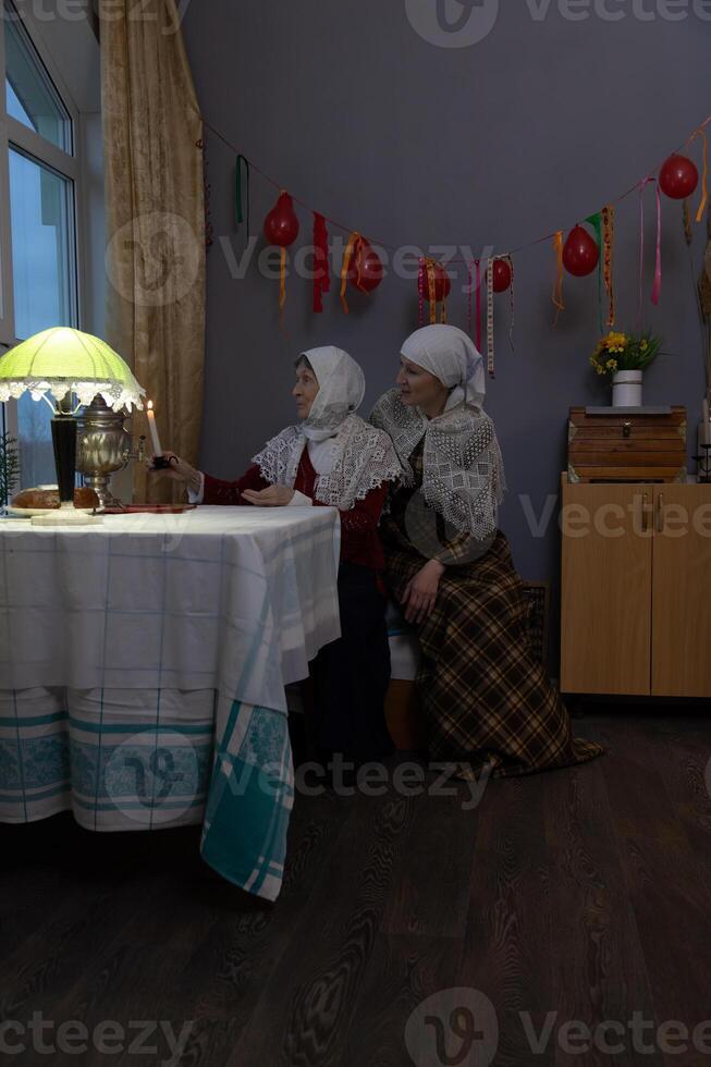 Two women sitting at a table photo