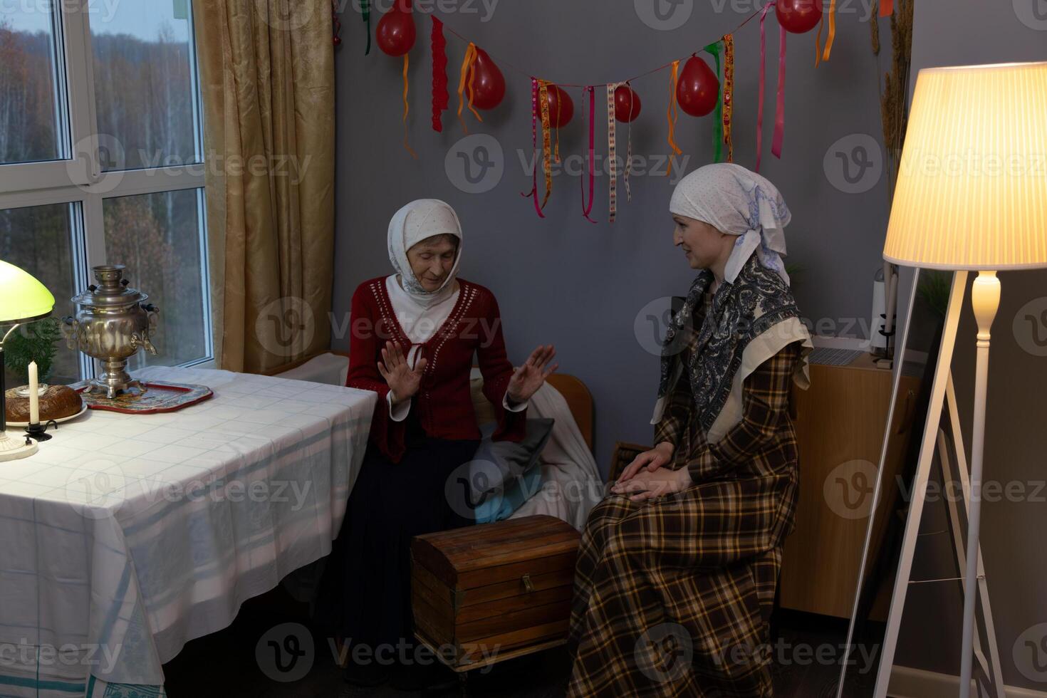 Two women sitting at a table photo