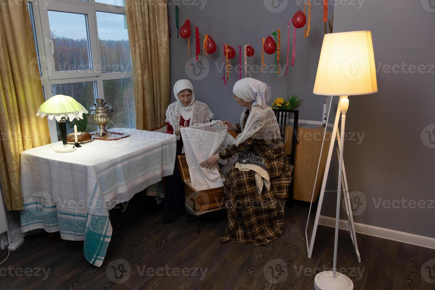 Two women sitting at a table photo