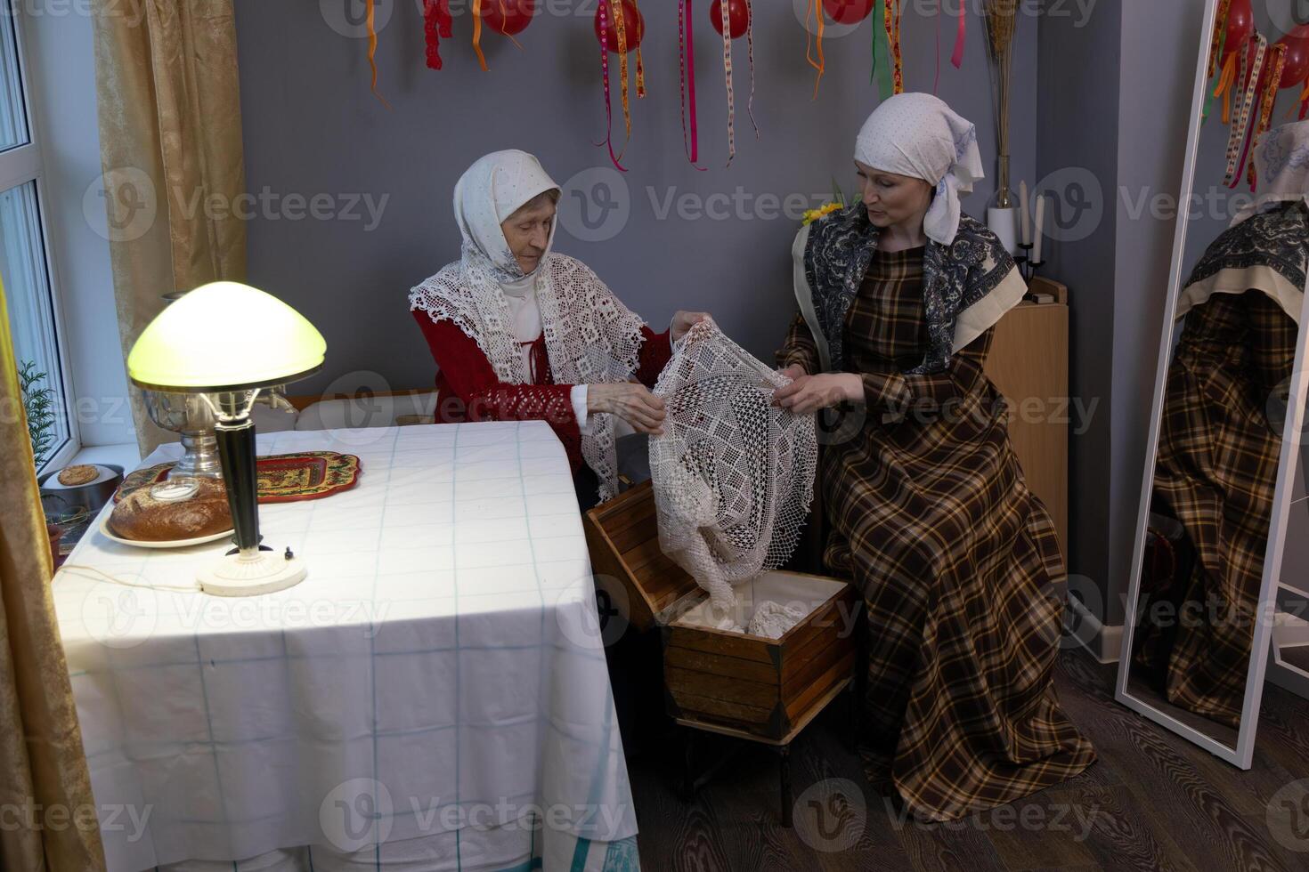 Two women sitting at a table photo