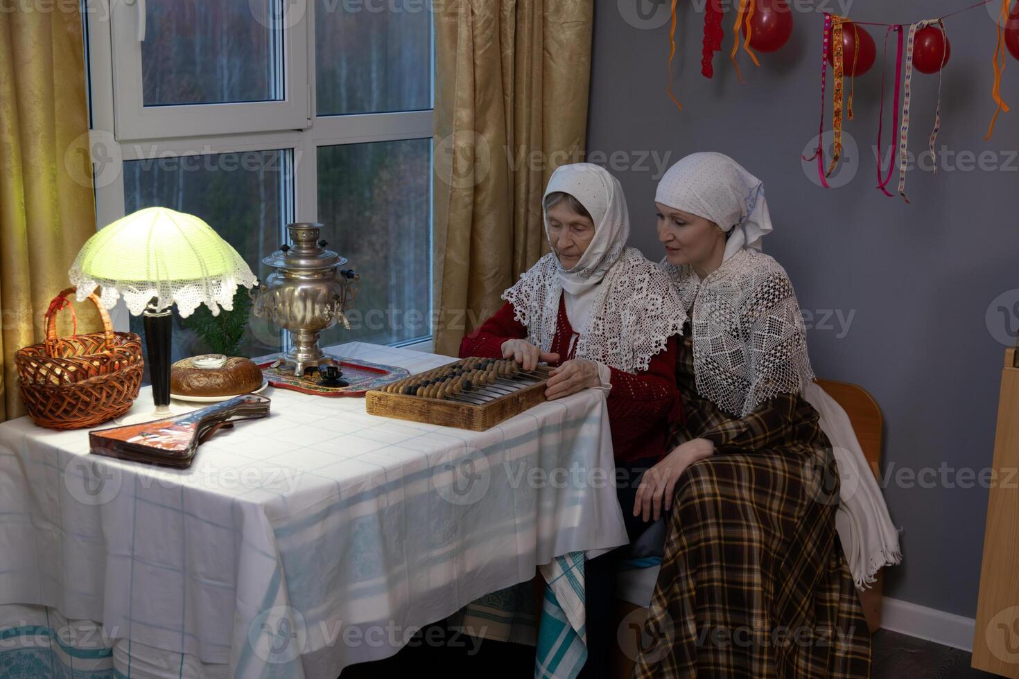 Two women sitting at a table photo