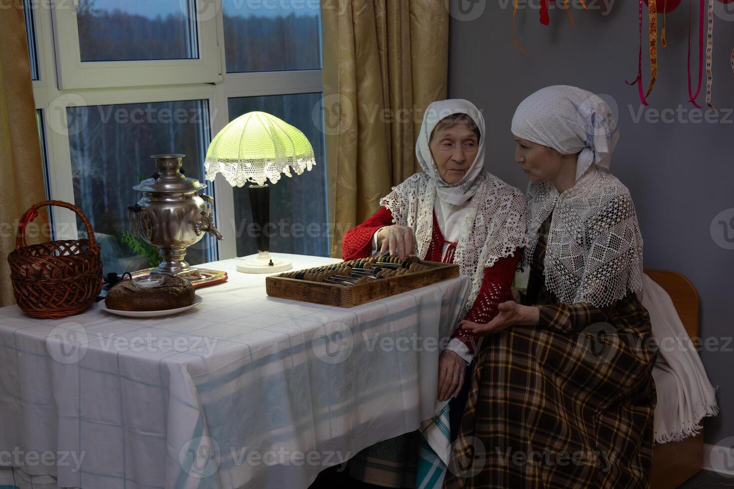 Two women sitting at a table photo