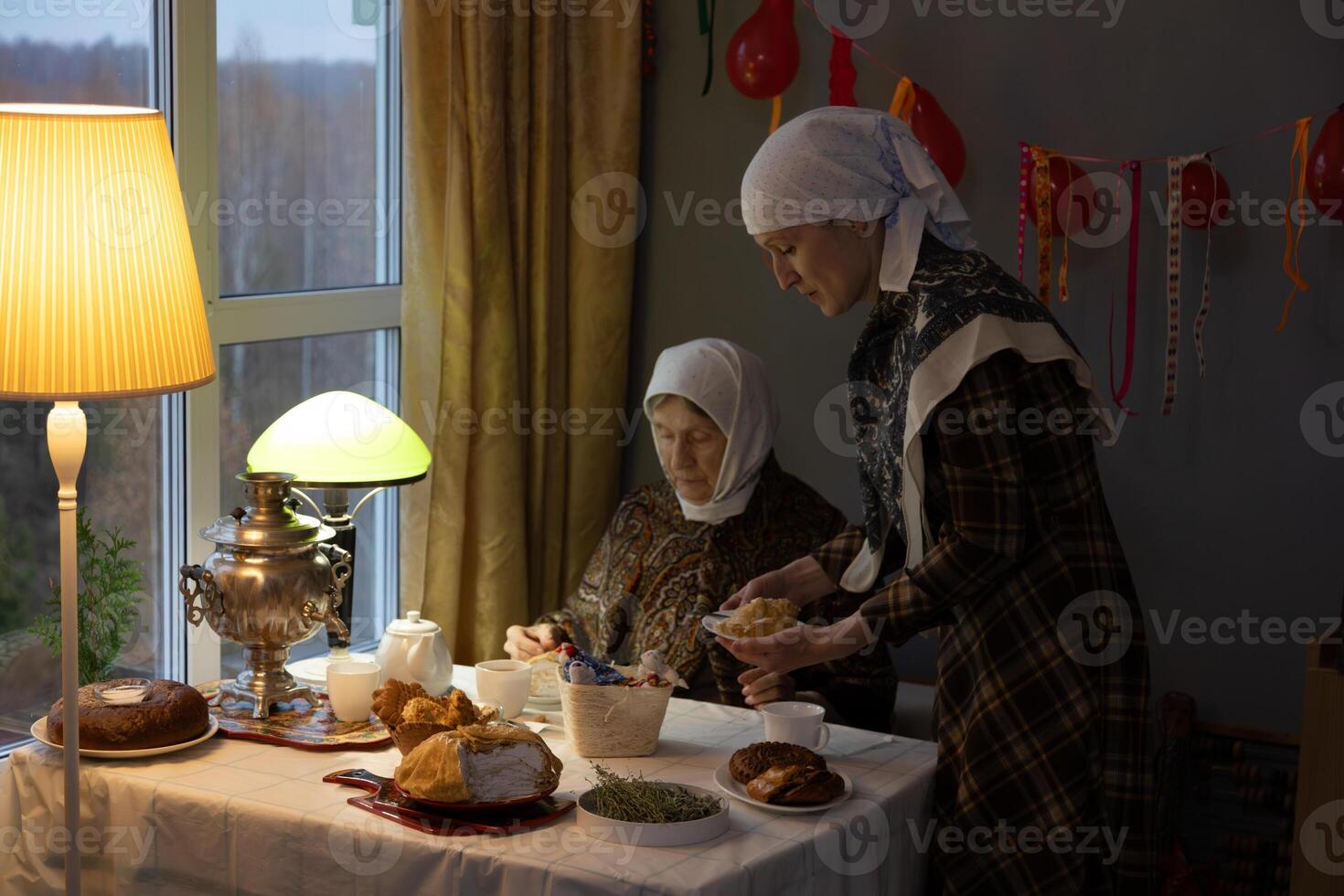 Two women sitting at a table photo