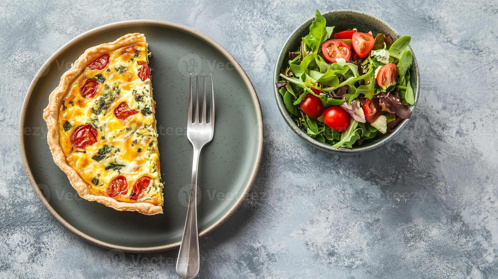 Plate with quiche slice, small salad bowl, and fork on the side, food photography photo