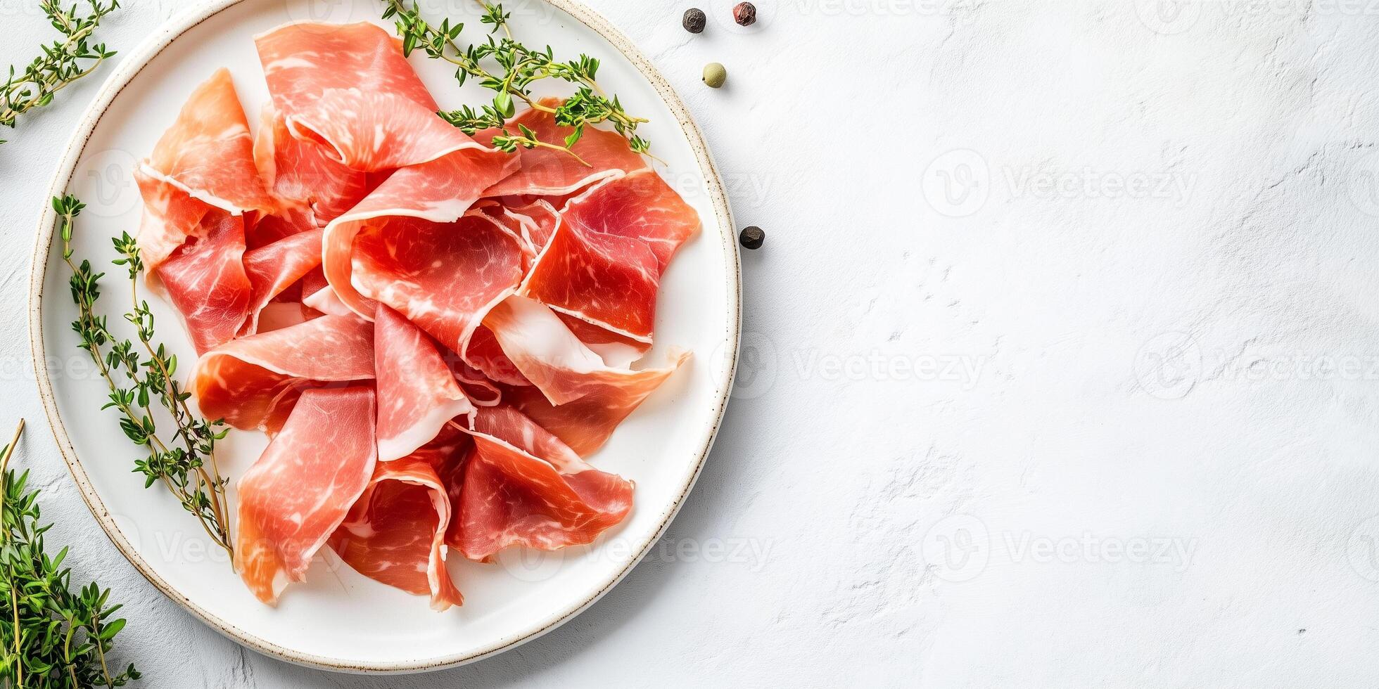 Prosciutto slices displayed on a white plate, with a sprig of fresh herbs, meal photography photo