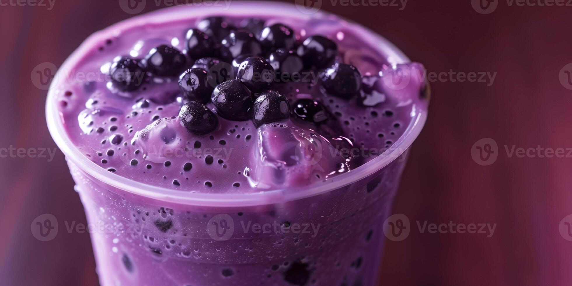 Plastic cup filled with purple taro-flavored drink, topped with black tapioca pearls, gastronomy photography photo