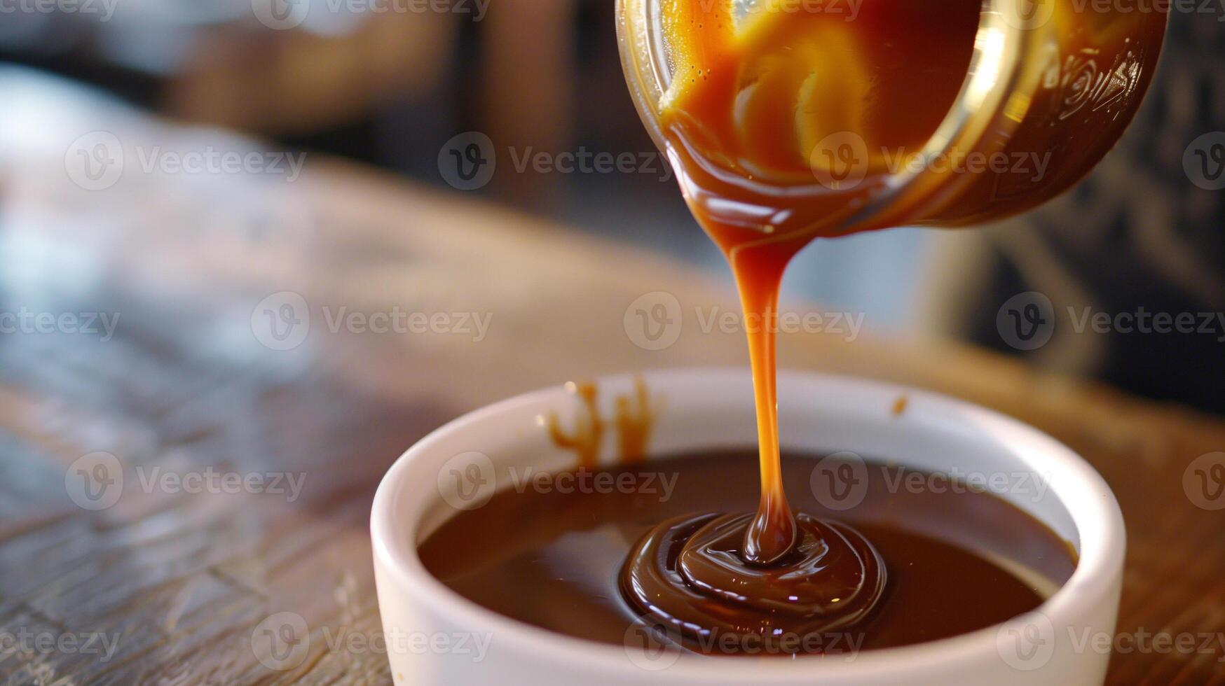 Stream of caramel sauce being poured from a jar into a bowl, gastronomy photography photo