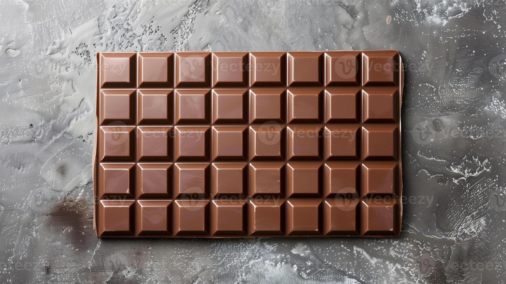 Plain chocolate bar laid flat on a surface, clearly divided into several equally sized squares, gastronomy photography photo