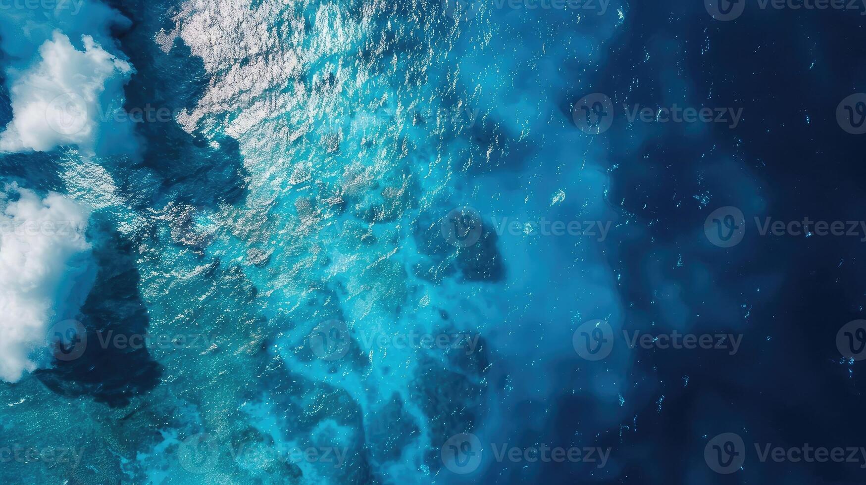 An aerial view of the ocean and clouds photo