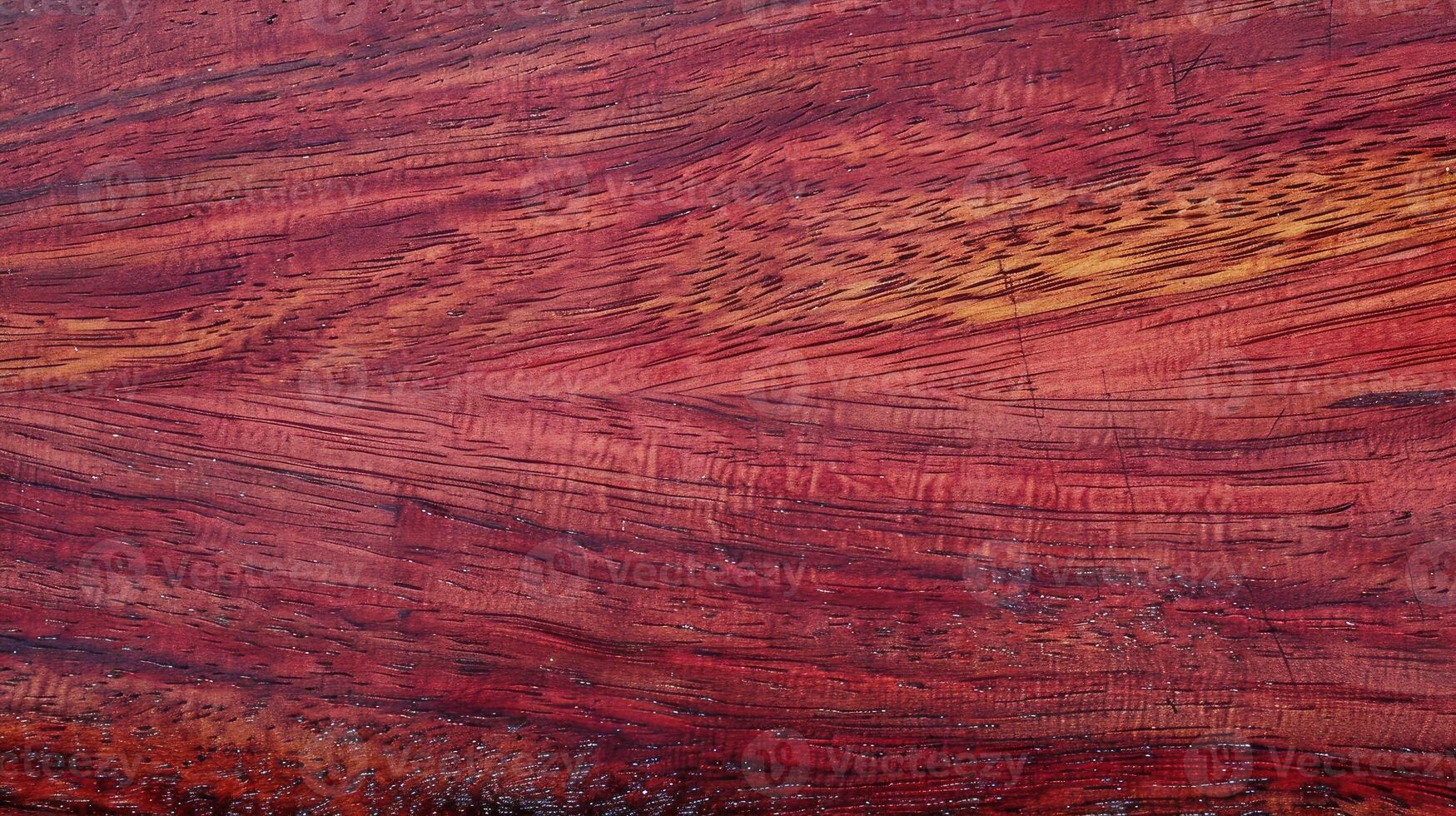 A red wood surface with a pattern of red and orange photo