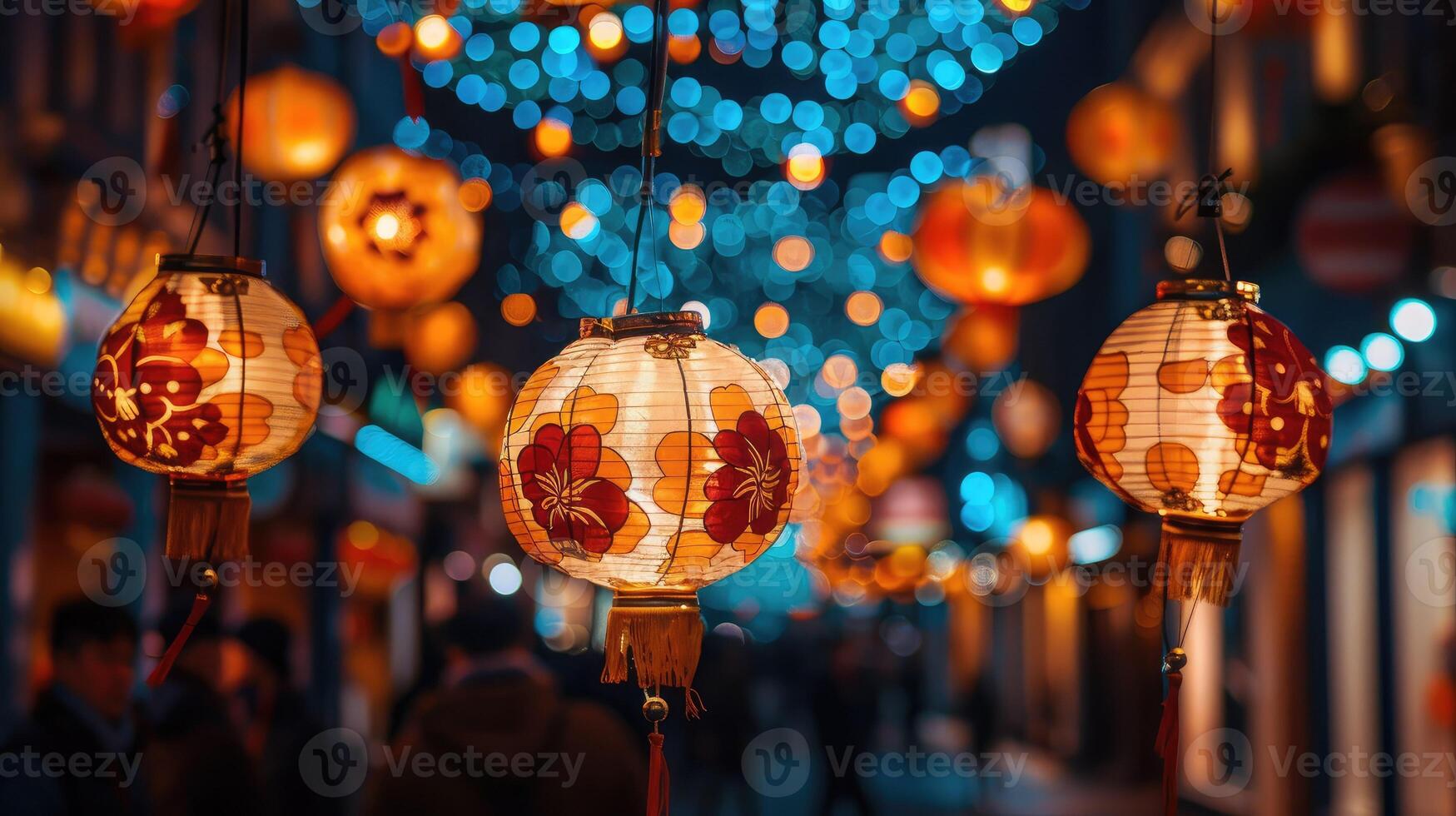 Chinese lanterns hanging from a street light photo
