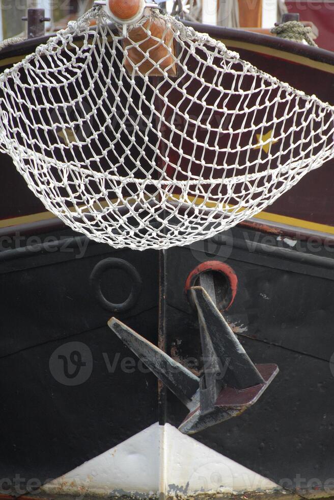 A boat with a net attached to it photo