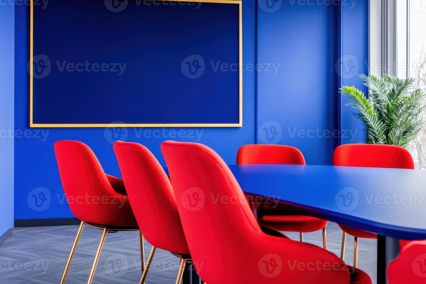 Corporate meeting room with blue screens and red chairs in a minimalist design on a bright and modern workspace photo