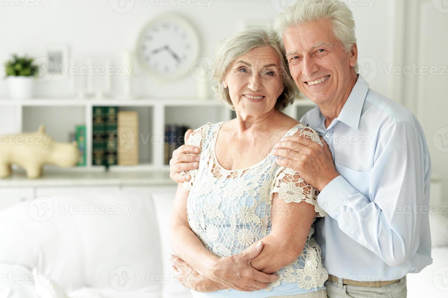 Close up portrait of senior couple posing at home photo