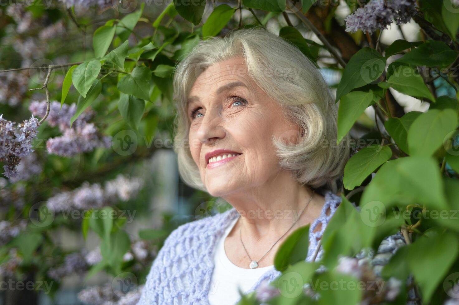 Portrait of a beautiful woman in the park in summer photo