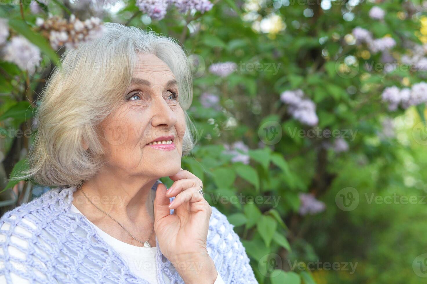 Portrait of a beautiful woman in the park in summer photo