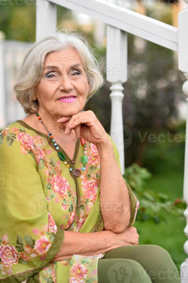 Portrait of a beautiful woman in the park in summer photo