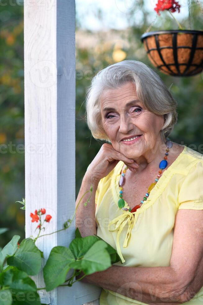 Portrait of a beautiful woman in the park in summer photo