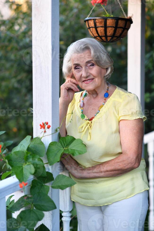 Portrait of a beautiful woman in the park in summer photo