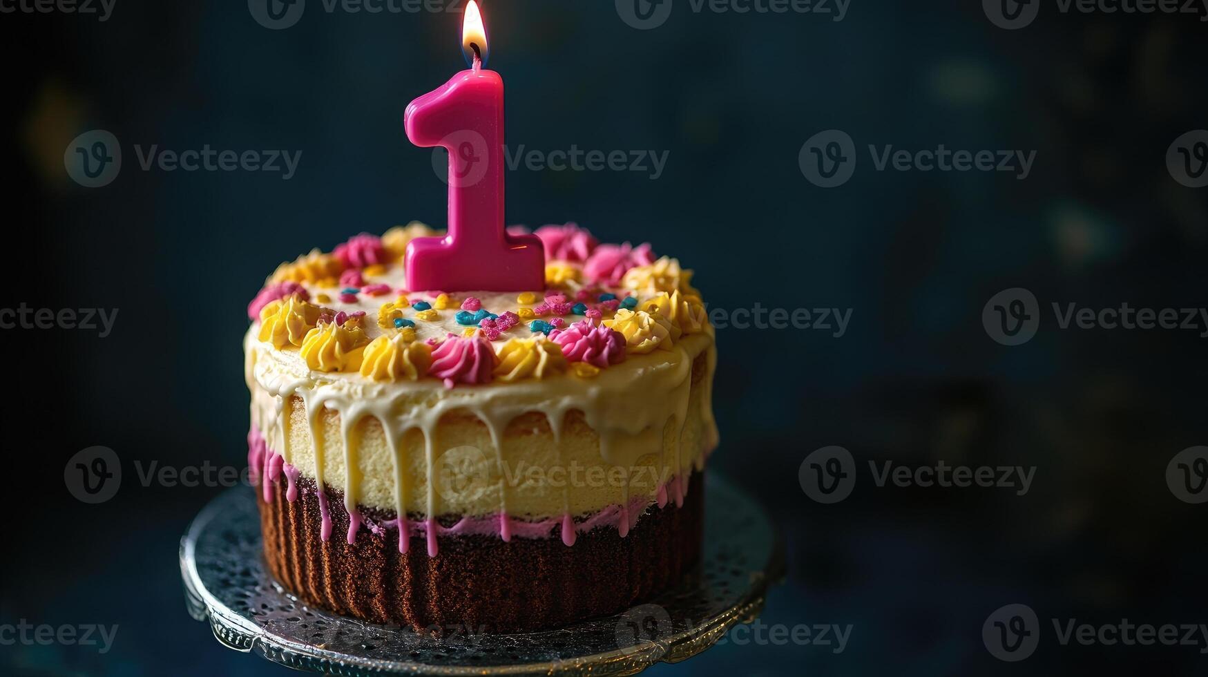 Small birthday cake celebrating first year with lit candle and colorful sprinkles photo
