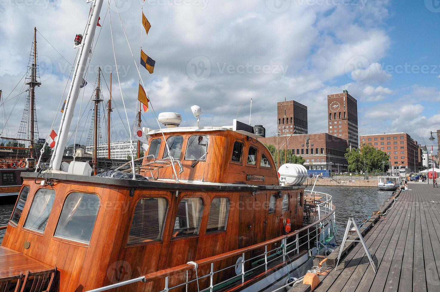 A wooden boat on the water in oslo photo