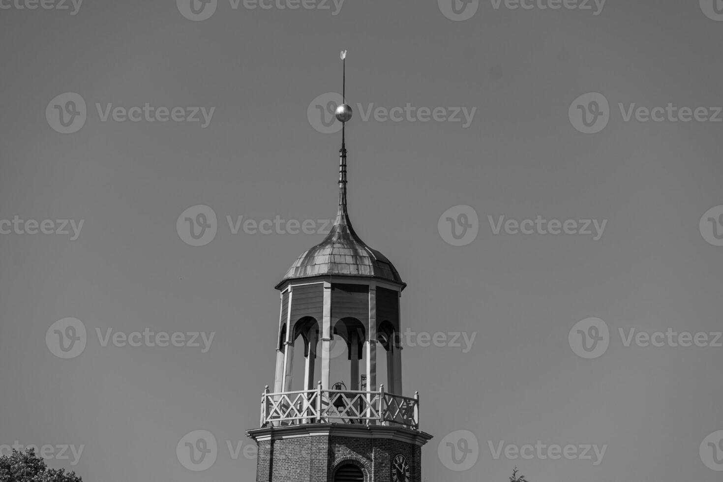 A clock tower with a clock on it photo
